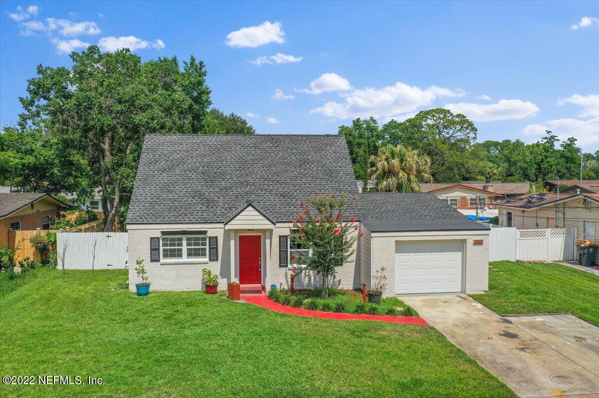 4057 Dayrl Road Jacksonville, FL 32207 - Photo 18 of 21 a front view of a house with a garden and yard