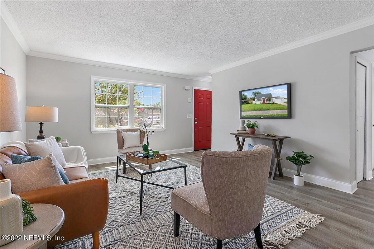 4057 Dayrl Road Jacksonville, FL 32207 - Photo 3 of 21 a living room with furniture and a window