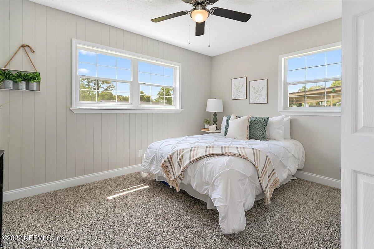 4057 Dayrl Road Jacksonville, FL 32207 - Photo 6 of 21 a bedroom with a bed and painting on the wall