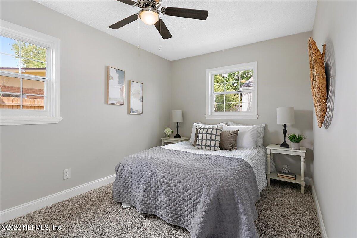 4057 Dayrl Road Jacksonville, FL 32207 - Photo 8 of 21 a bedroom with a bed and window