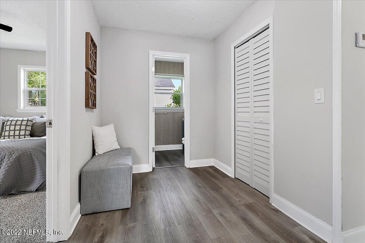 4057 Dayrl Road Jacksonville, FL 32207 - Photo 10 of 21 a bedroom with furniture and wooden floor