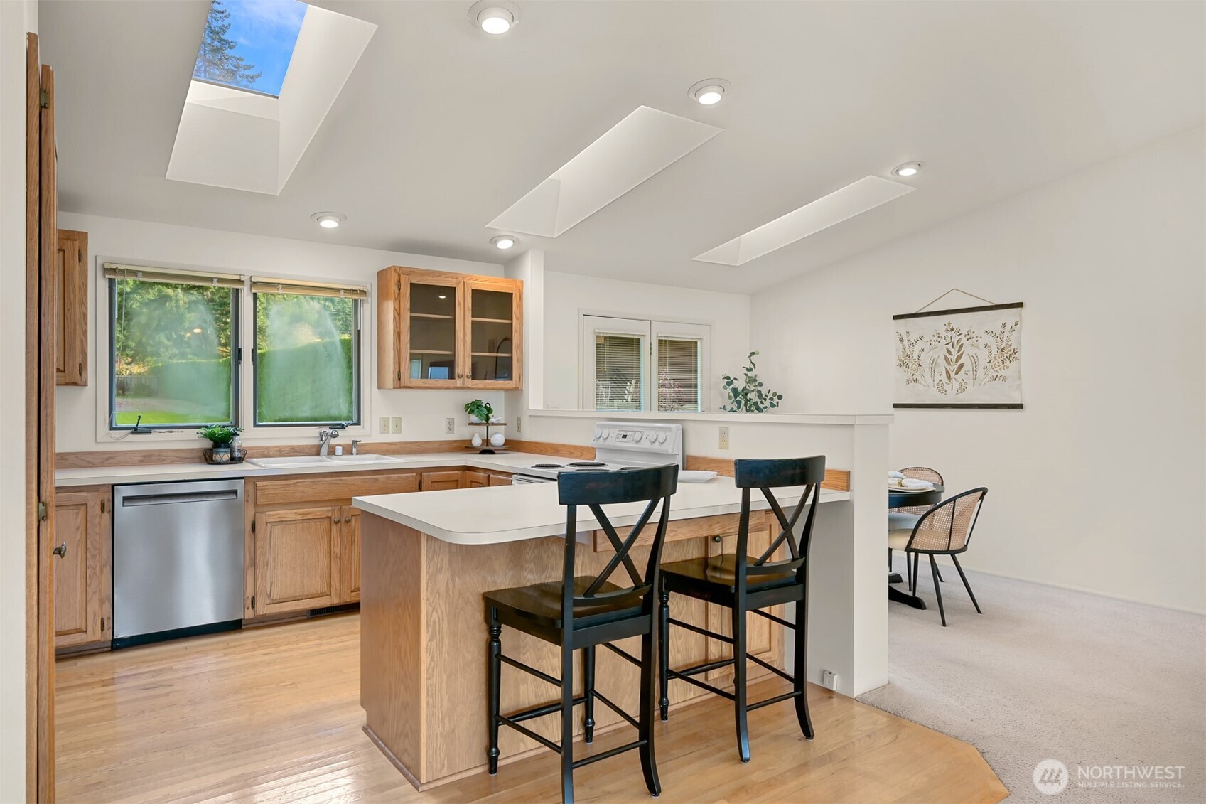 3187 North Shore Road Bellingham, WA 98226 - Photo 16 of 40 a kitchen with a table and chairs in it