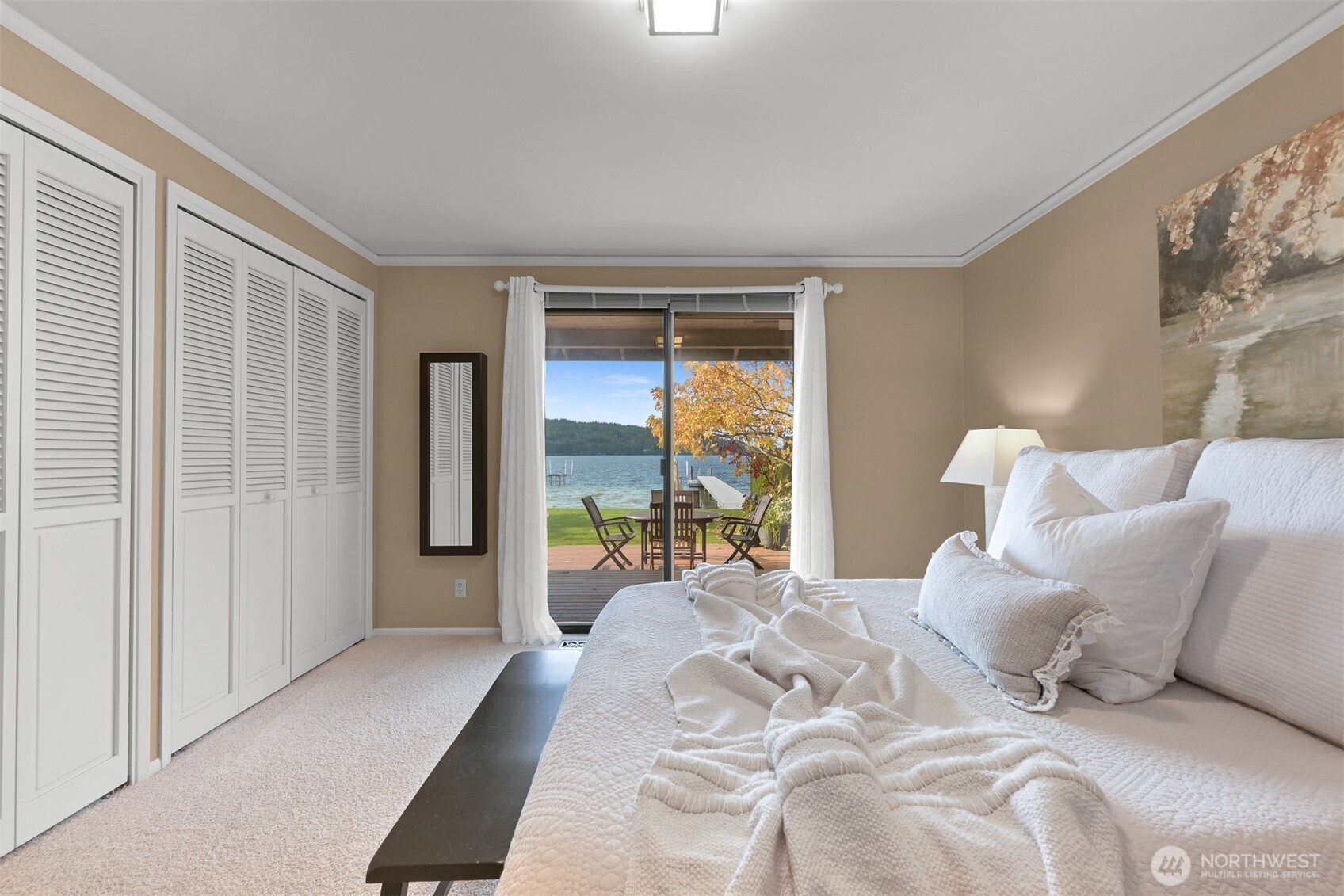 3187 North Shore Road Bellingham, WA 98226 - Photo 20 of 40 a bedroom with a bed and glass walk in closet