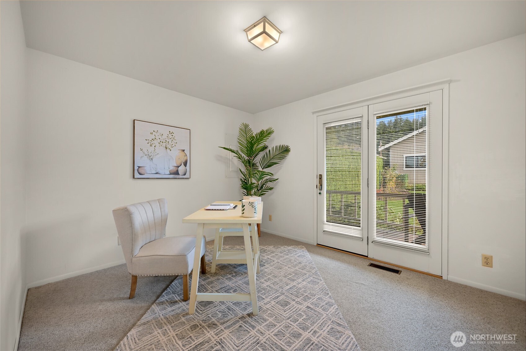 3187 North Shore Road Bellingham, WA 98226 - Photo 21 of 40 a living room with furniture and a potted plant