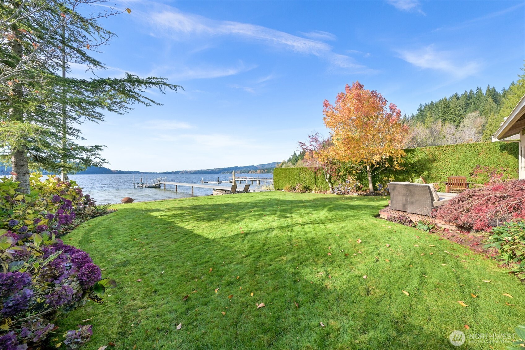3187 North Shore Road Bellingham, WA 98226 - Photo 31 of 40 a view of a garden with a building in the background