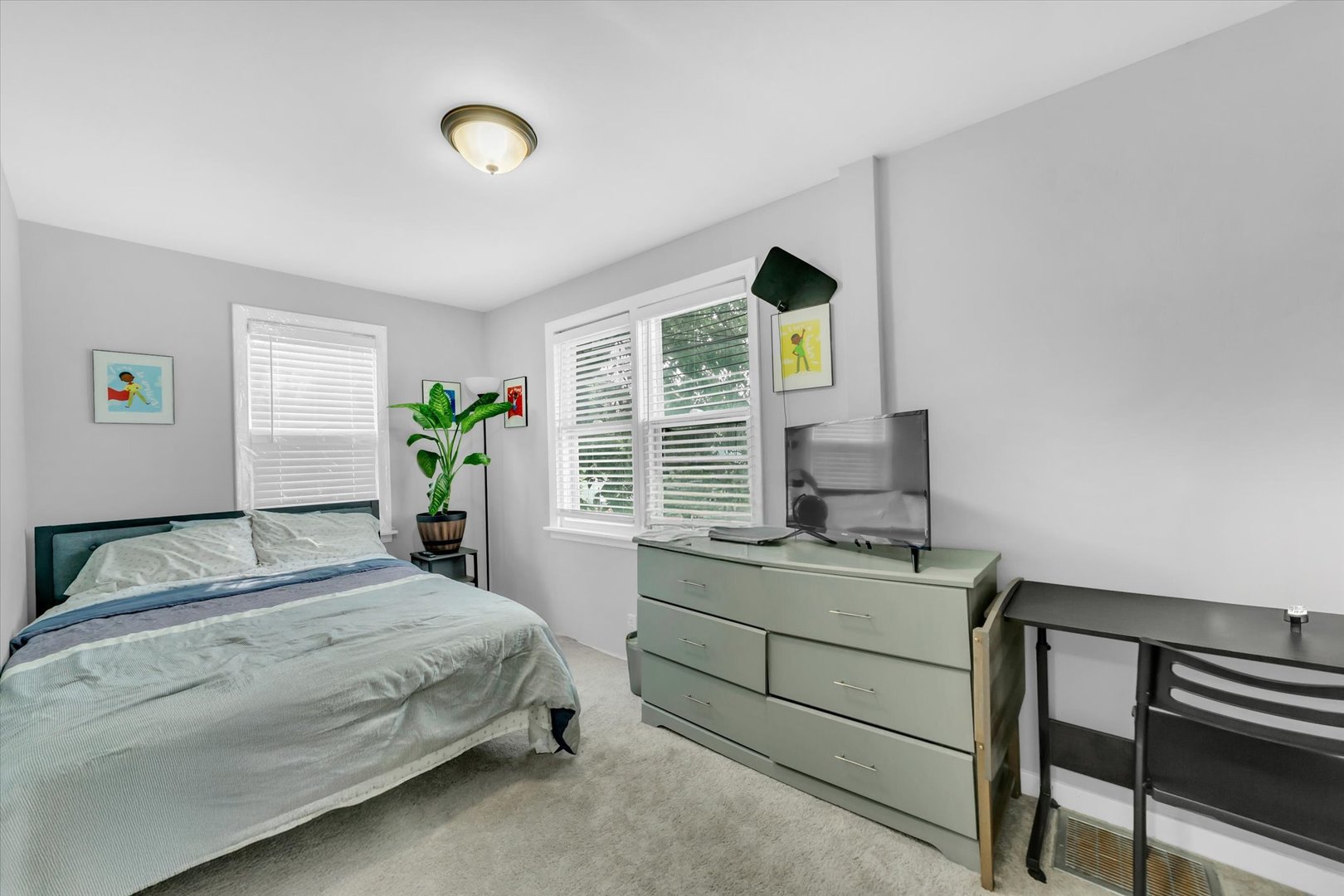 10002 South Torrence Avenue Chicago, IL 60617 - Photo 11 of 46 a bedroom with a bed and a desk