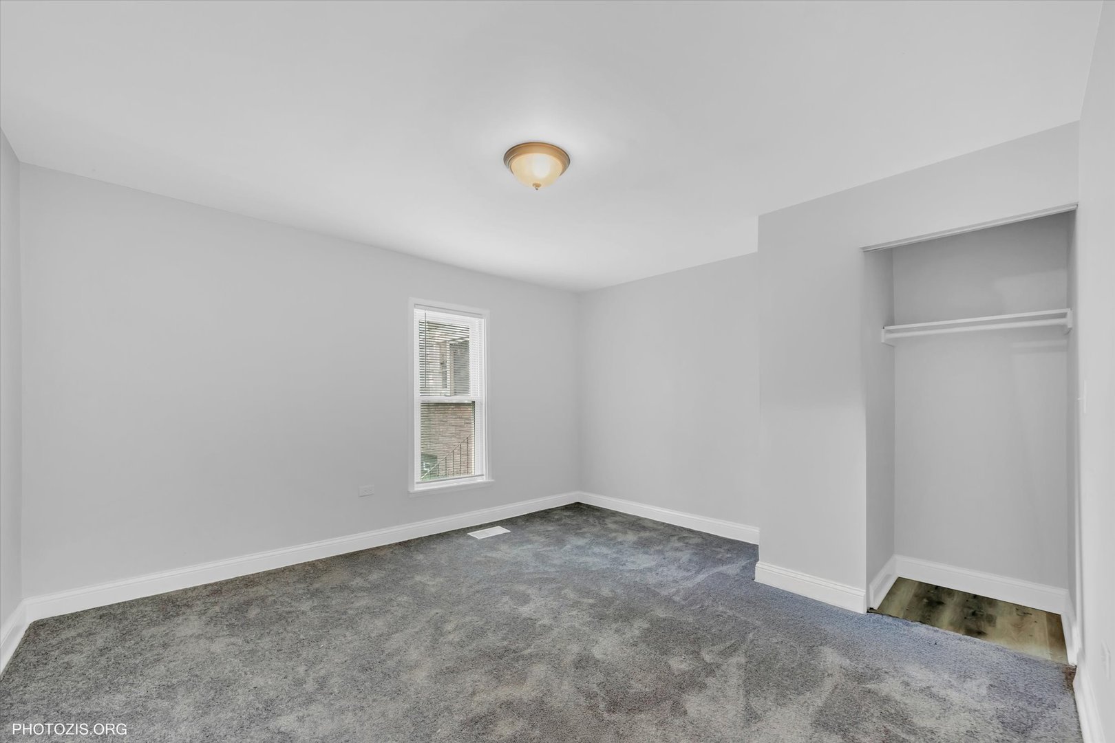 10002 South Torrence Avenue Chicago, IL 60617 - Photo 19 of 46 an empty room with windows