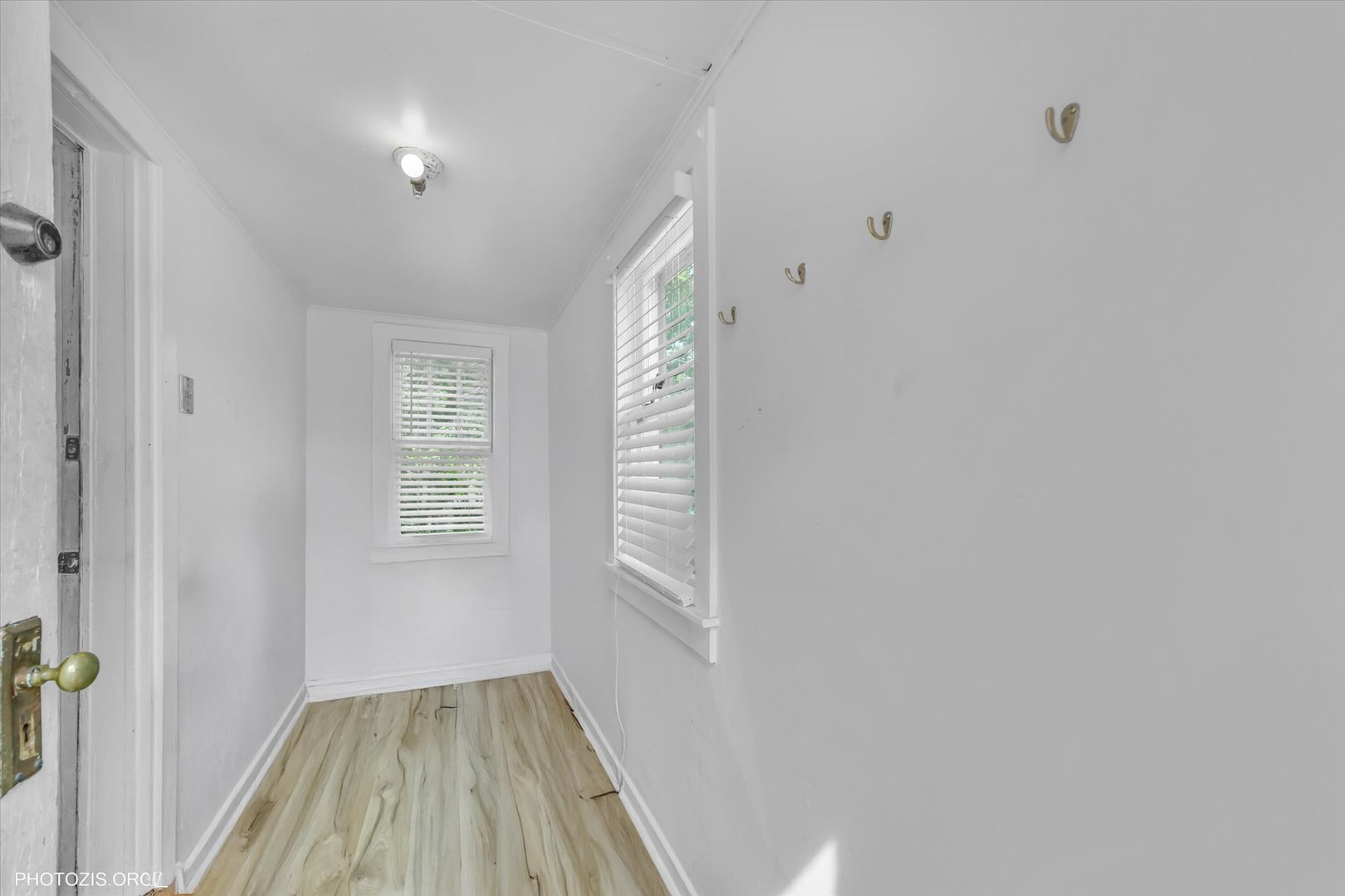 10002 South Torrence Avenue Chicago, IL 60617 - Photo 9 of 46 a view of hallway with window and stairs