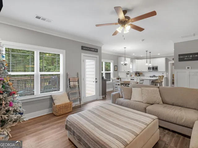 a view of a dining room with furniture window and wooden floor