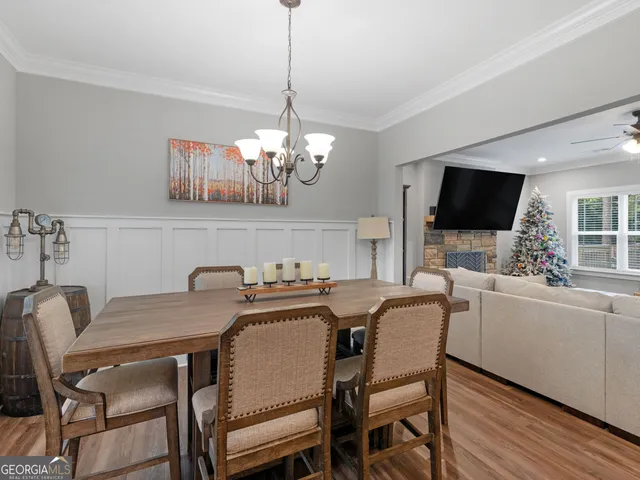 a view of a dining room with furniture and window