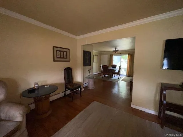 a view of a livingroom with workspace and a couch