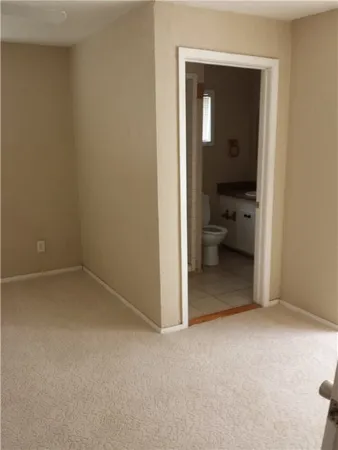 a view of a room that has a bench in it