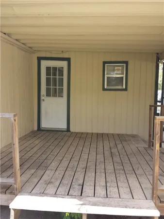 a bathroom with a granite countertop toilet and a sink