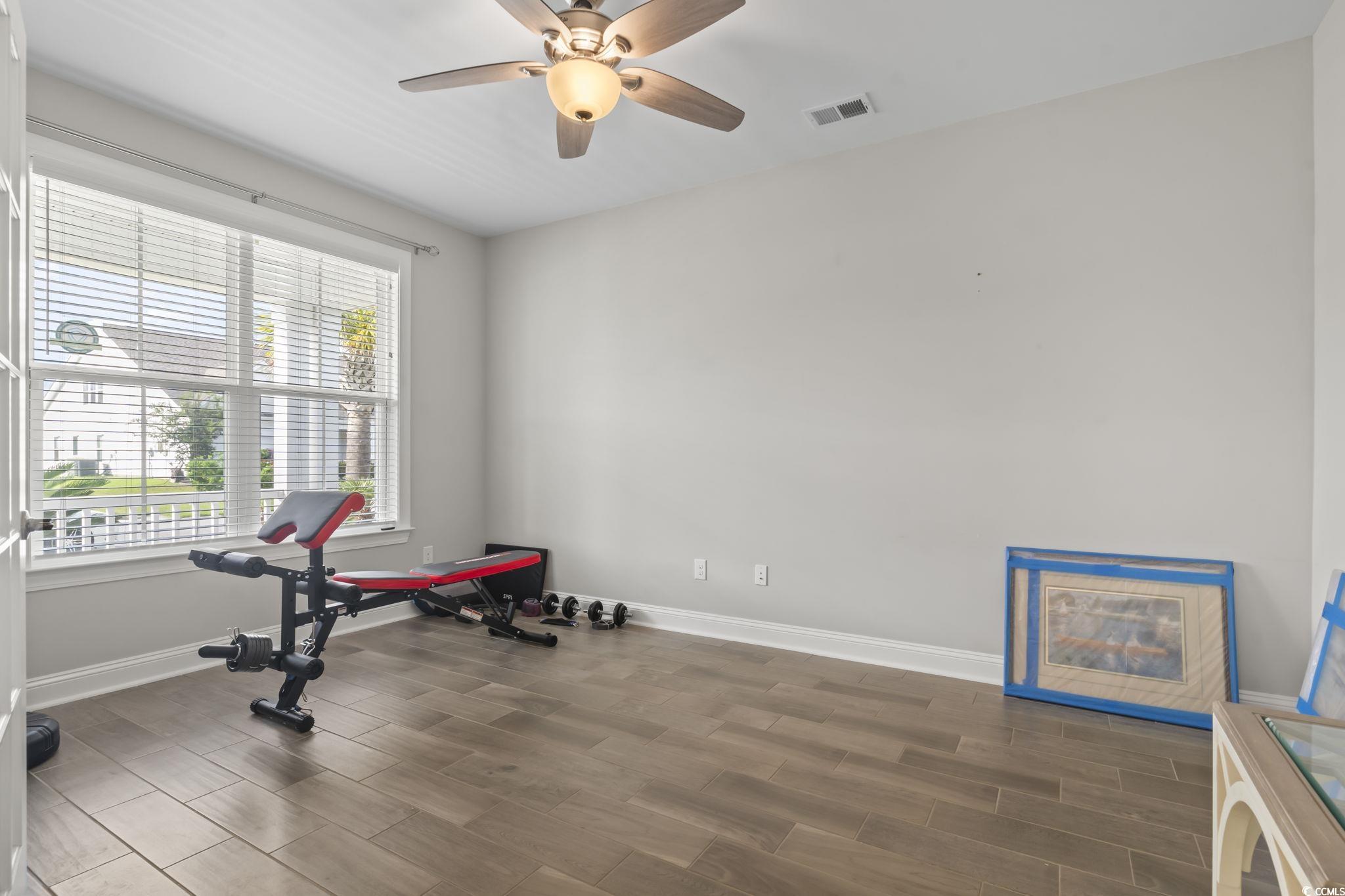 583 Hickman Street Surfside Beach, SC 29575 - Photo 16 of 40 Exercise area with wood tiled floors and a ceiling fan