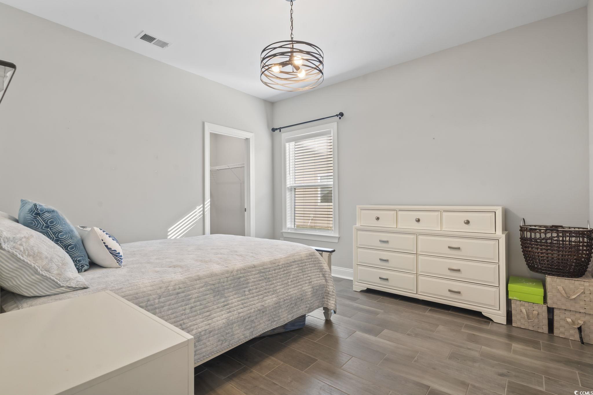 583 Hickman Street Surfside Beach, SC 29575 - Photo 28 of 40 Bedroom with wood tiled floors and a spacious closet