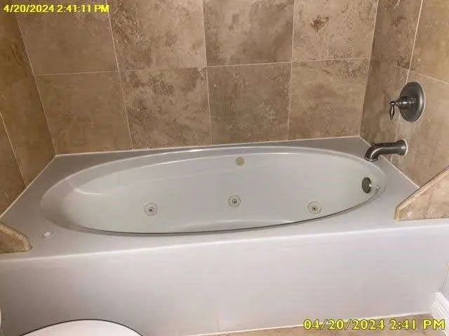 a bathroom with a bath tub