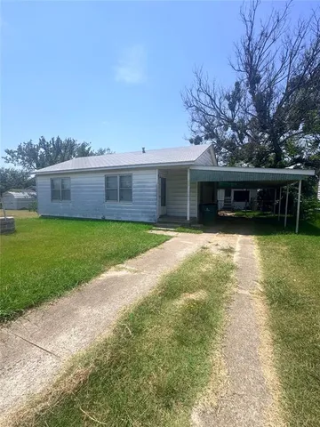 a view of a house with swimming pool and yard