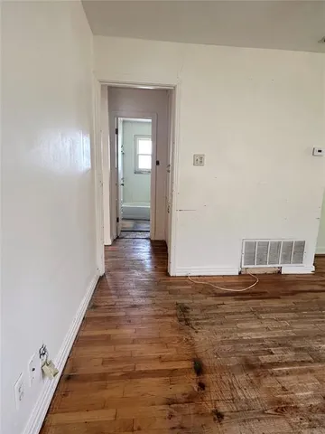 a view of a livingroom with wooden floor