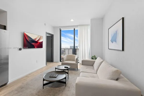 a view of a living room and bathroom