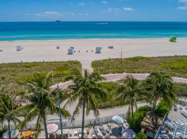 a swimming pool with outdoor seating and yard