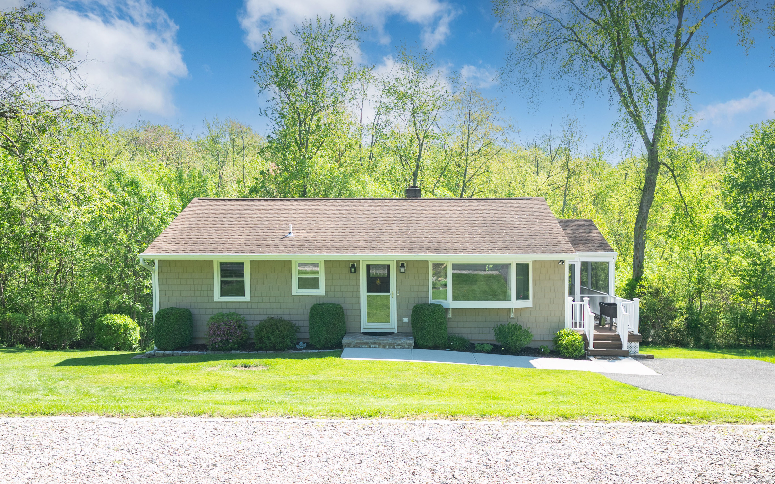 a view of a house with a yard and plants