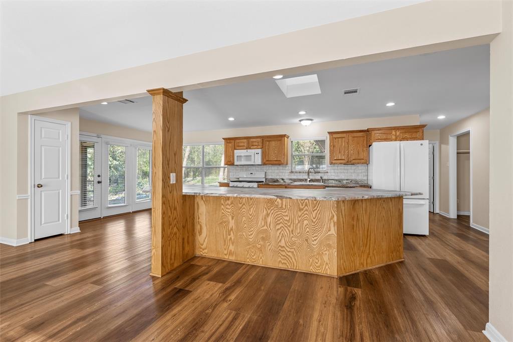 4505 Shady Glen Drive Waco, TX 76708 - Photo 11 of 40 a view of kitchen with cabinets and wooden floor