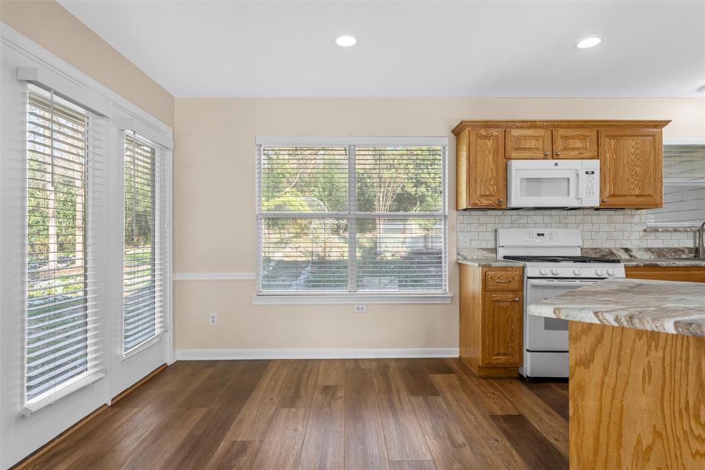 4505 Shady Glen Drive Waco, TX 76708 - Photo 15 of 40 wooden floor in an empty room with a window