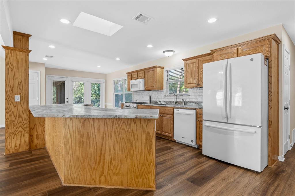 4505 Shady Glen Drive Waco, TX 76708 - Photo 16 of 40 a kitchen with stainless steel appliances granite countertop a refrigerator sink and microwave