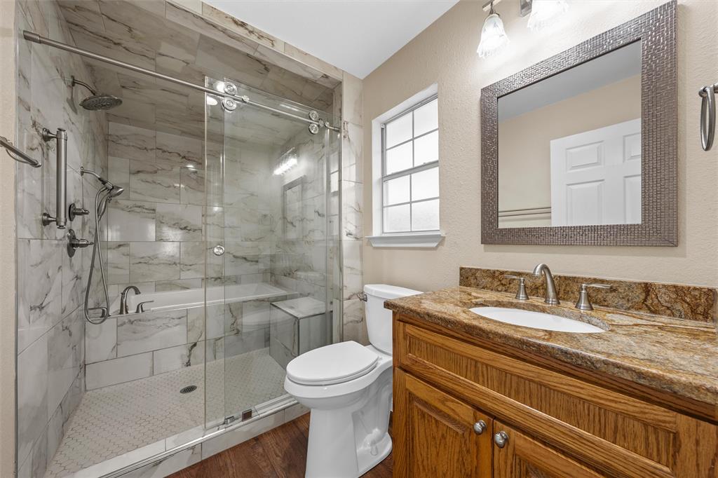 4505 Shady Glen Drive Waco, TX 76708 - Photo 20 of 40 a bathroom with a sink a toilet and shower