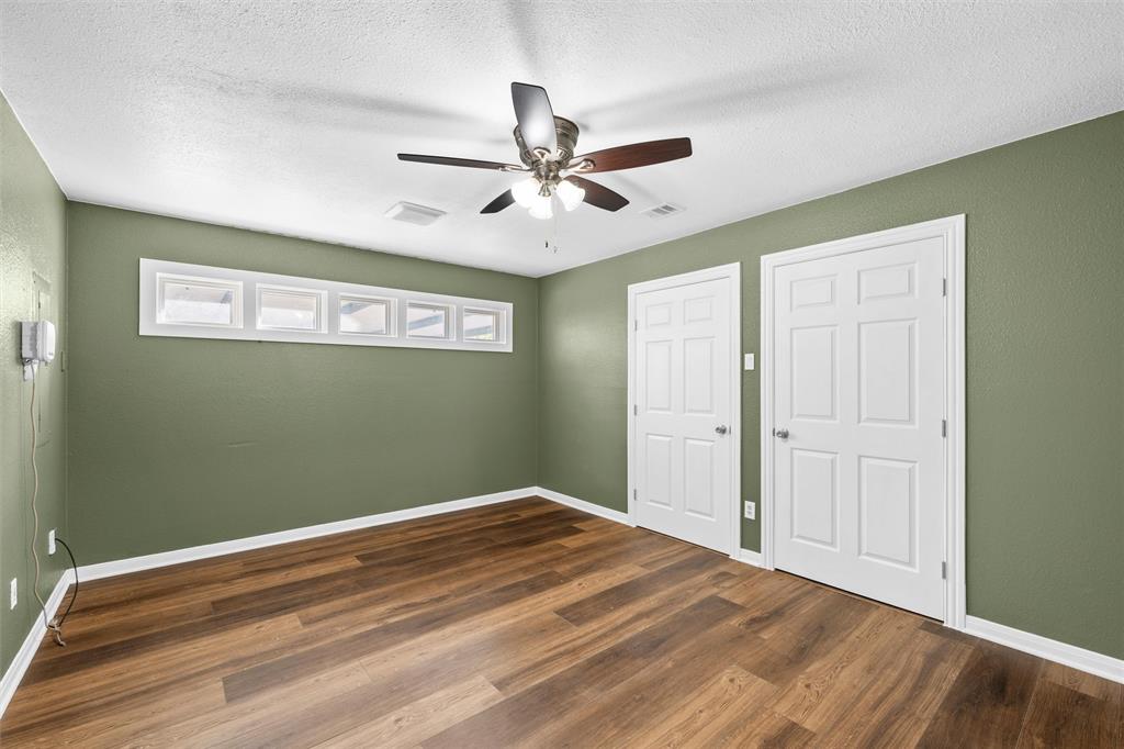 4505 Shady Glen Drive Waco, TX 76708 - Photo 21 of 40 a view of a room with a ceiling fan and hardwood floor