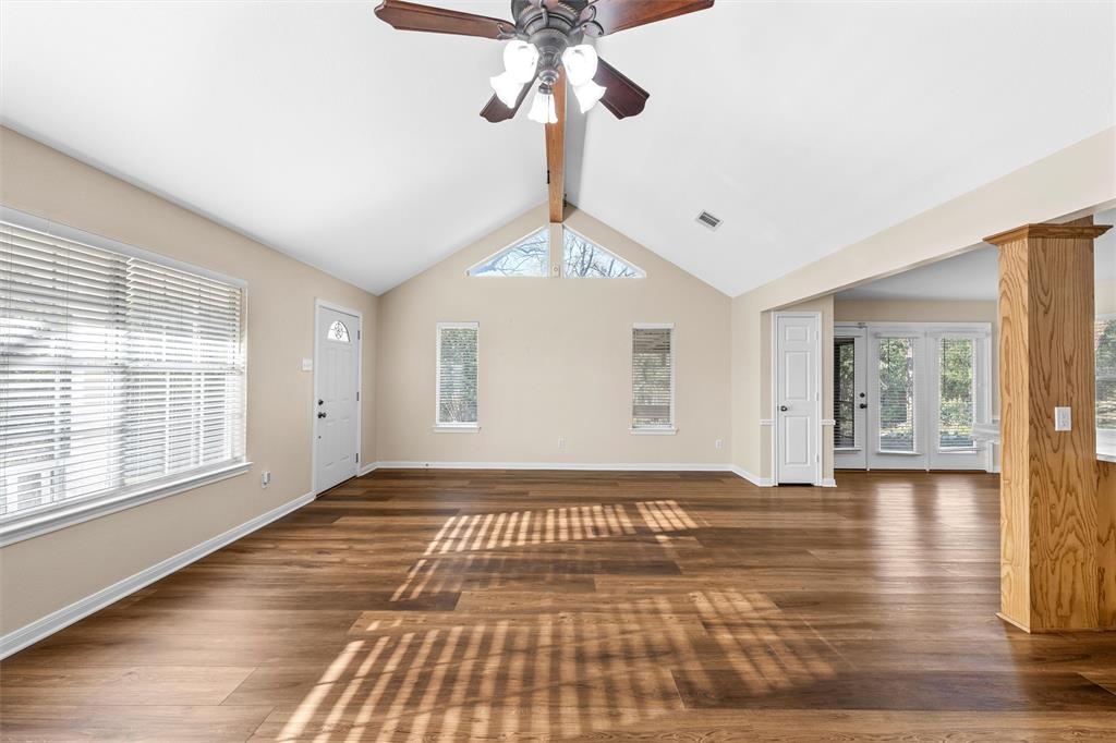 4505 Shady Glen Drive Waco, TX 76708 - Photo 10 of 40 a view of an empty room with wooden floor and a window