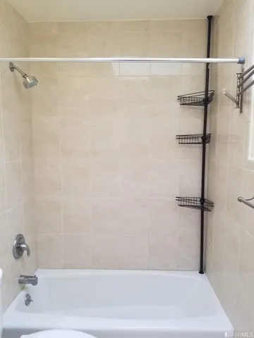 a bathroom with a shower and a bathtub