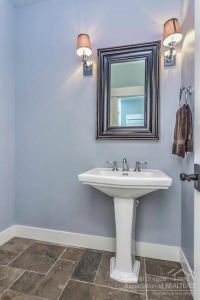 63528 Old Deschutes Road Bend, OR 97701 - Photo 6 of 25 a bathroom with a sink and a mirror