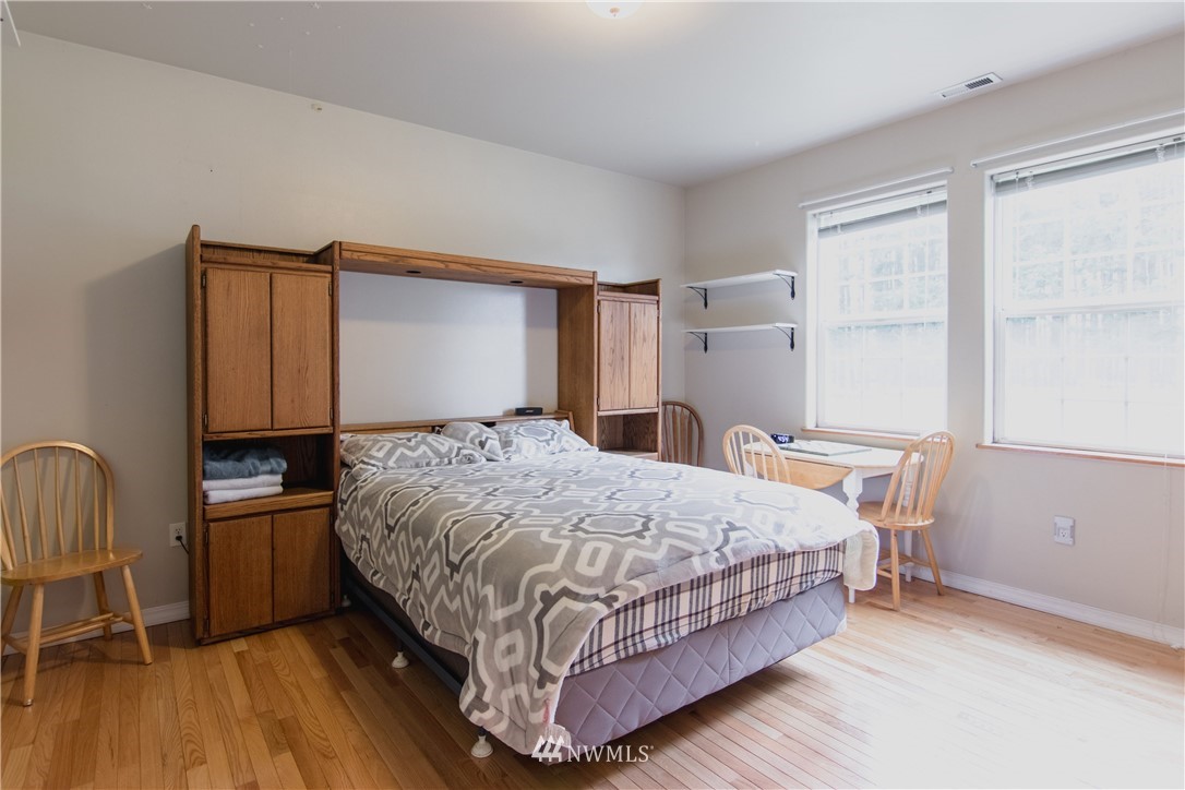 18222 Presley Lane Southwest Rochester, WA 98579 - Photo 14 of 24 a bedroom with a bed chair and a window