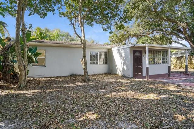 a view of a house with a tree