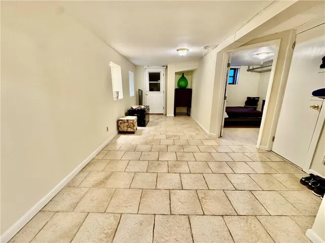 a bedroom with a bed and a chair