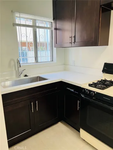 a kitchen with a sink and a window