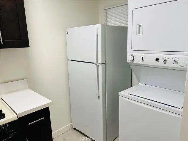 a bathroom with a sink shower and a mirror