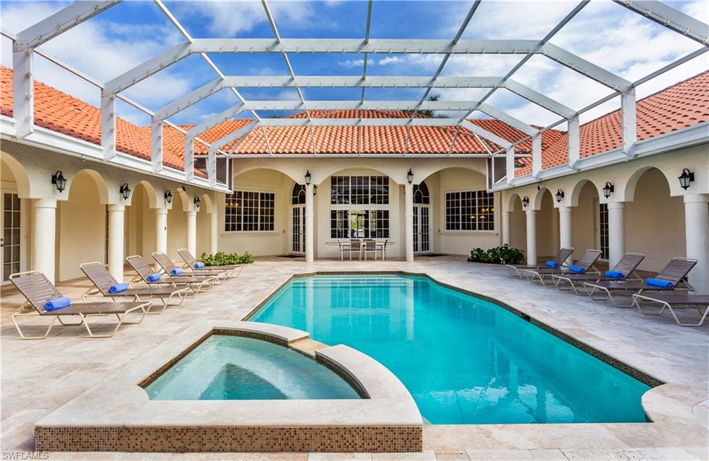 2225 23rd Street Southwest Naples, FL 34117 - Photo 1 of 44 a view of a house with swimming pool