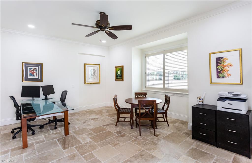 2225 23rd Street Southwest Naples, FL 34117 - Photo 14 of 44 a view of a workspace with furniture and a window
