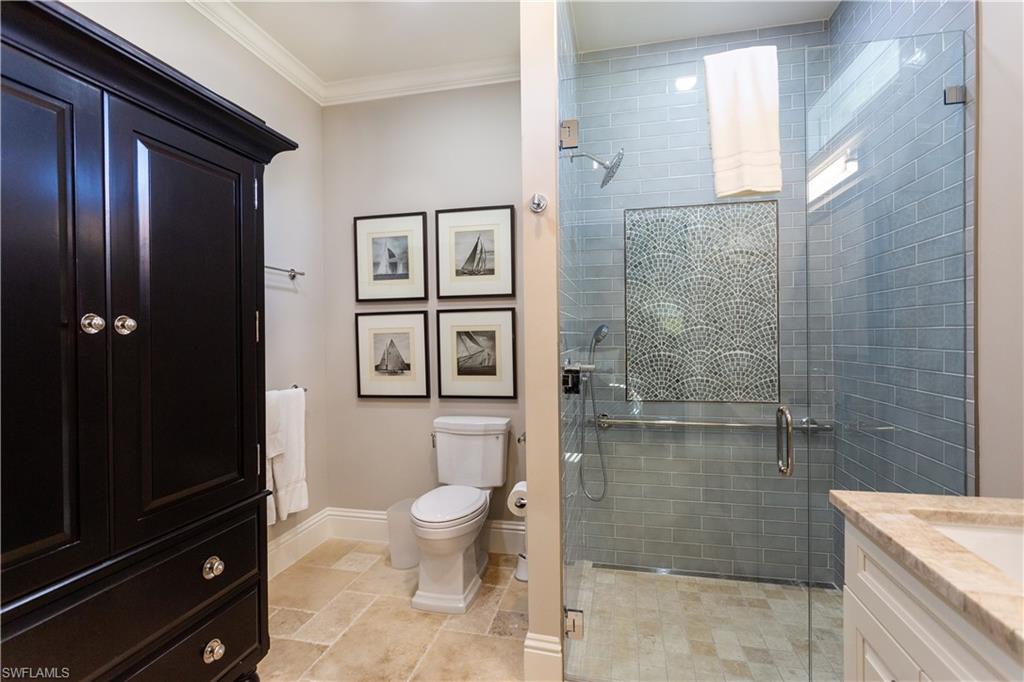 2225 23rd Street Southwest Naples, FL 34117 - Photo 24 of 44 a bathroom with a shower toilet and sink