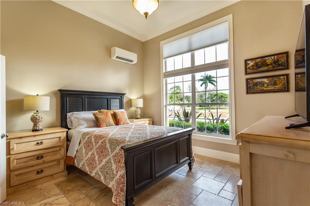 2225 23rd Street Southwest Naples, FL 34117 - Photo 26 of 44 a bedroom with a bed and a window