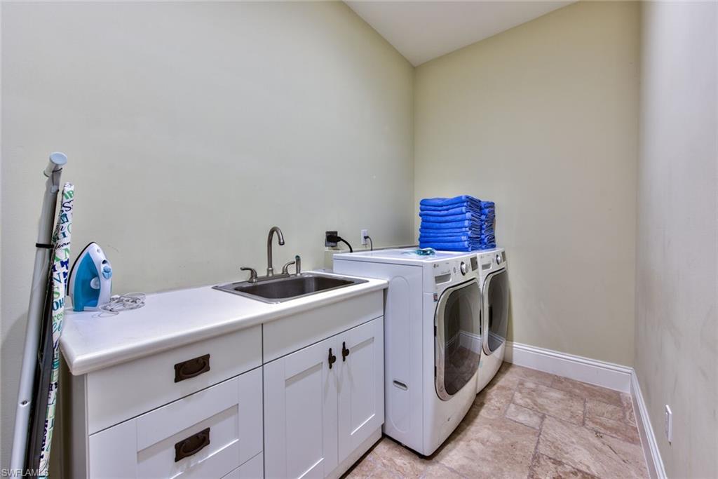 2225 23rd Street Southwest Naples, FL 34117 - Photo 36 of 44 a utility room with sink dryer and washer