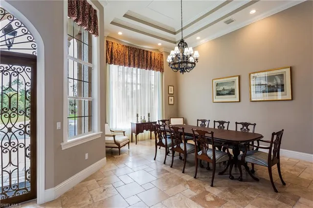 a view of a dining room with furniture window and chandelier
