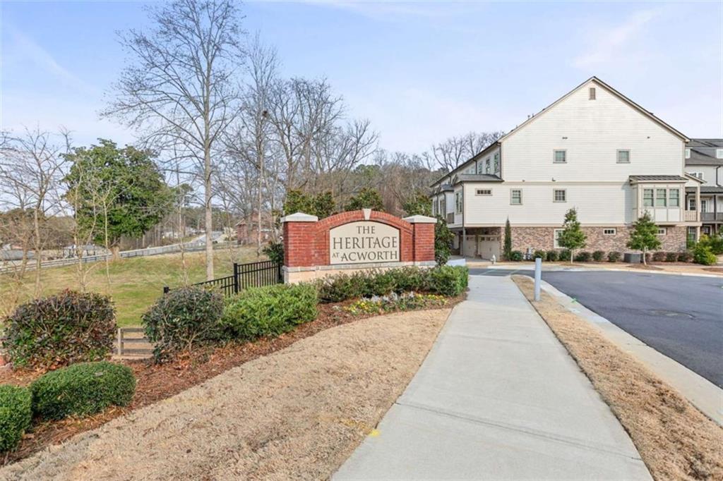 4466 Lemon Street Acworth, GA 30101 - Photo 53 of 65 a front view of a house with a yard and car parked