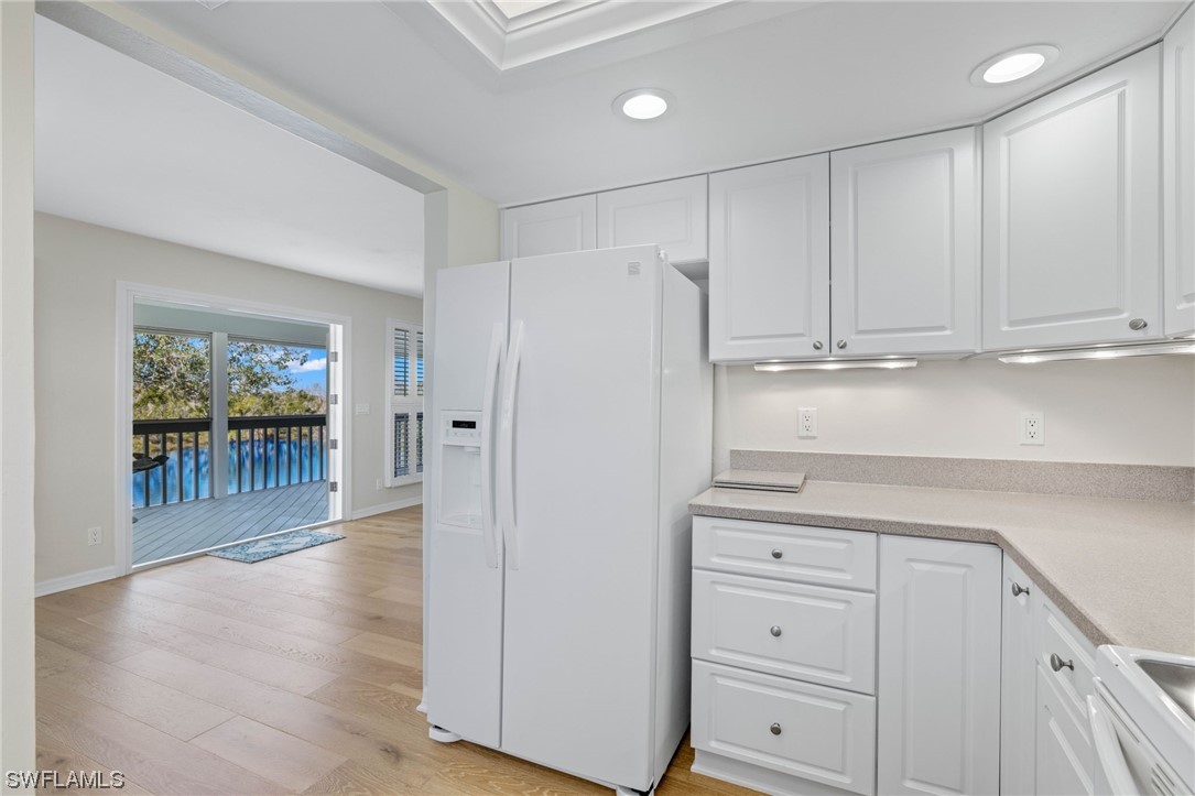 657 Rabbit Road Sanibel, FL 33957 - Photo 17 of 37 a view of a kitchen with wooden floor