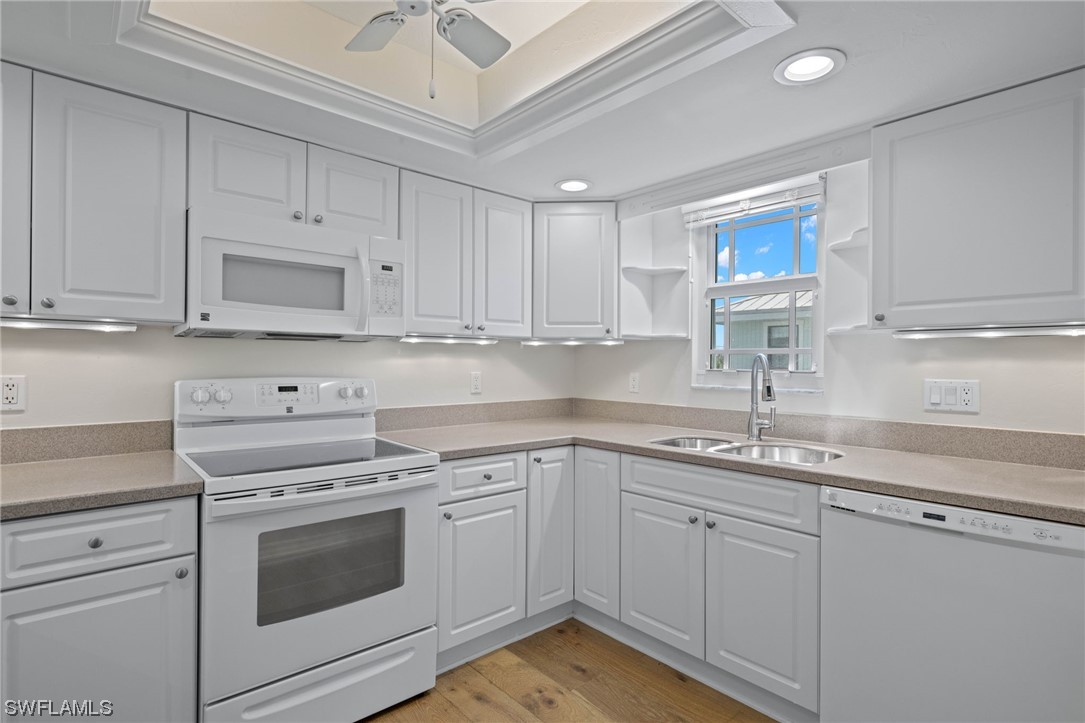 657 Rabbit Road Sanibel, FL 33957 - Photo 18 of 37 a kitchen with appliances cabinets and a sink
