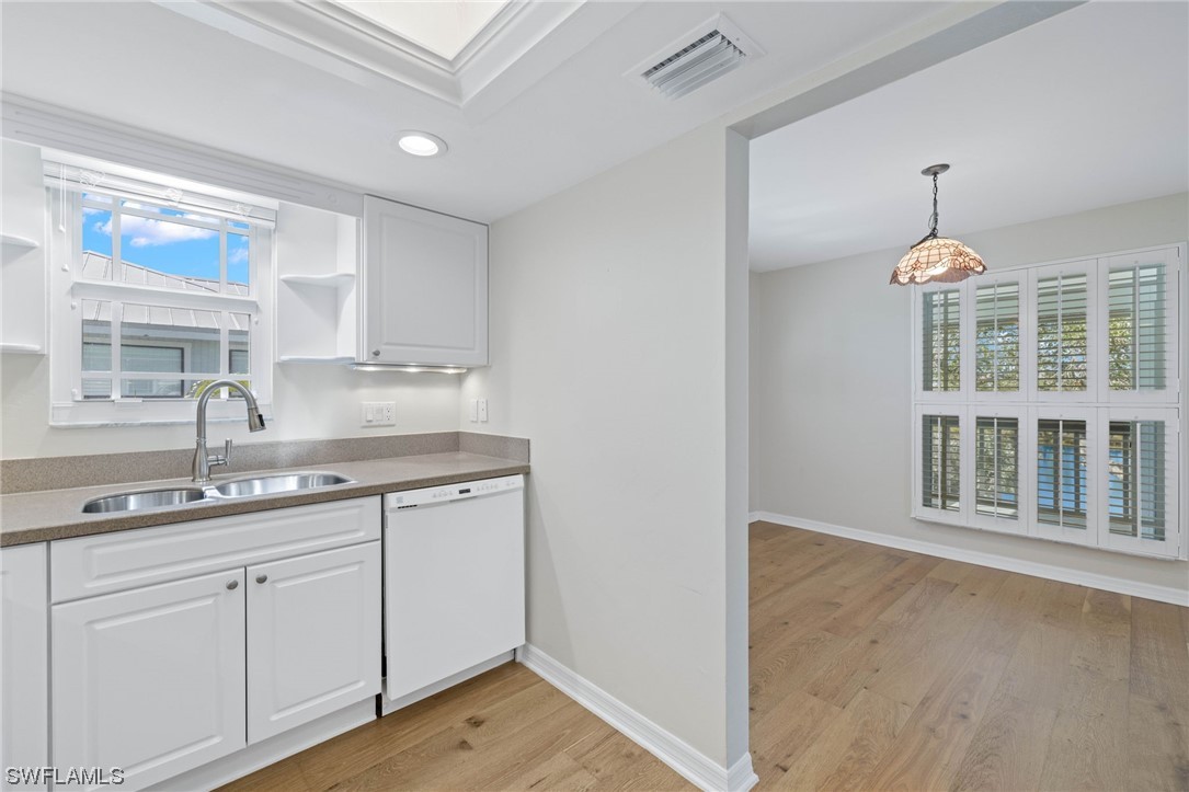 657 Rabbit Road Sanibel, FL 33957 - Photo 19 of 37 a kitchen with a sink cabinets and window