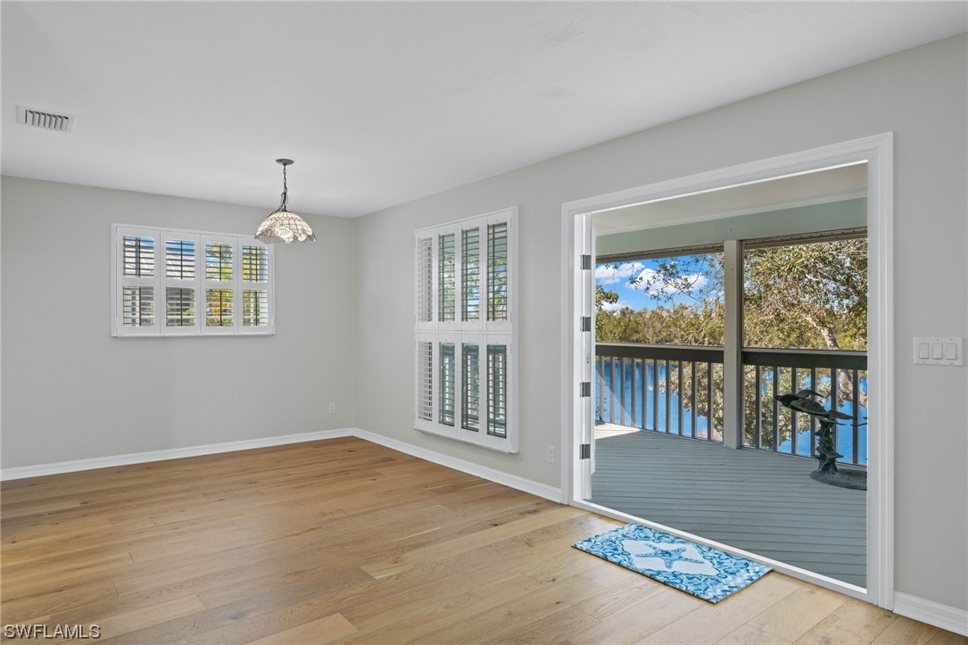 657 Rabbit Road Sanibel, FL 33957 - Photo 10 of 37 a view of an empty room with a window