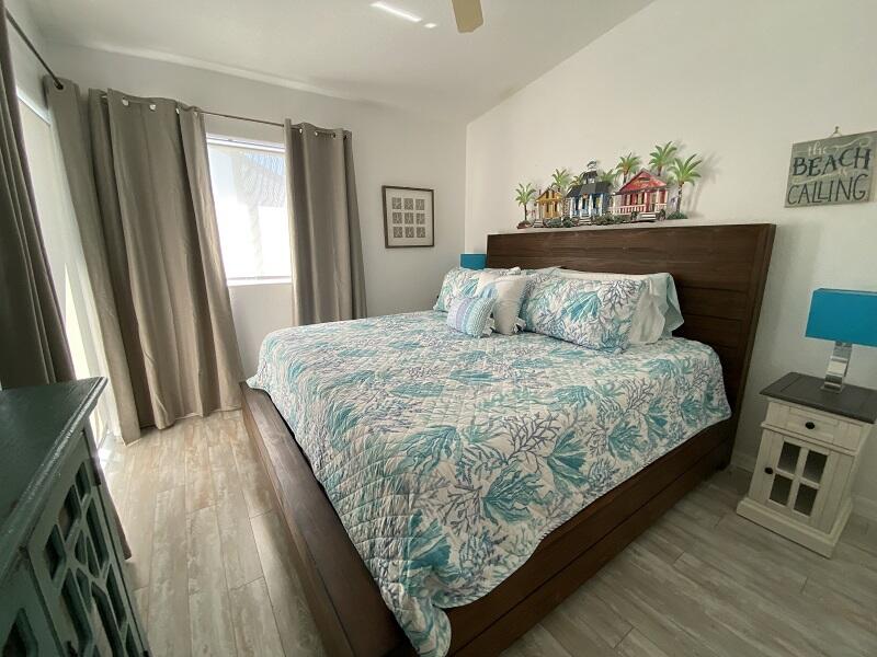 343 Ocean Park Lane, Unit V110 Cape Canaveral, FL 32920 - Photo 15 of 25 a large bed sitting in a bedroom next to a window